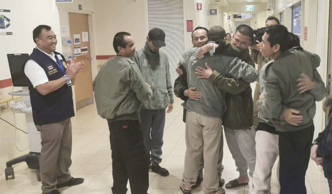 Thai hostages, who were previously released, hug their newly freed compatriots at the Shamir Medical Center in Israel on Sunday, Nov. 26, 2023. (AP)