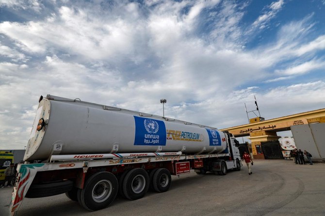 A truck carrying humanitarian aid from the United Nations Relief and Works Agency for Palestine Refugees arrives at the Rafah border crossing on Nov. 22, 2023.