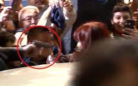 A still image taken from a video shows a man pointing a gun at Argentina’s Vice President Cristina Fernández in front of her home in Buenos Aires .