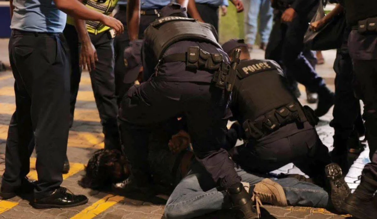 police arresting one of the protestors