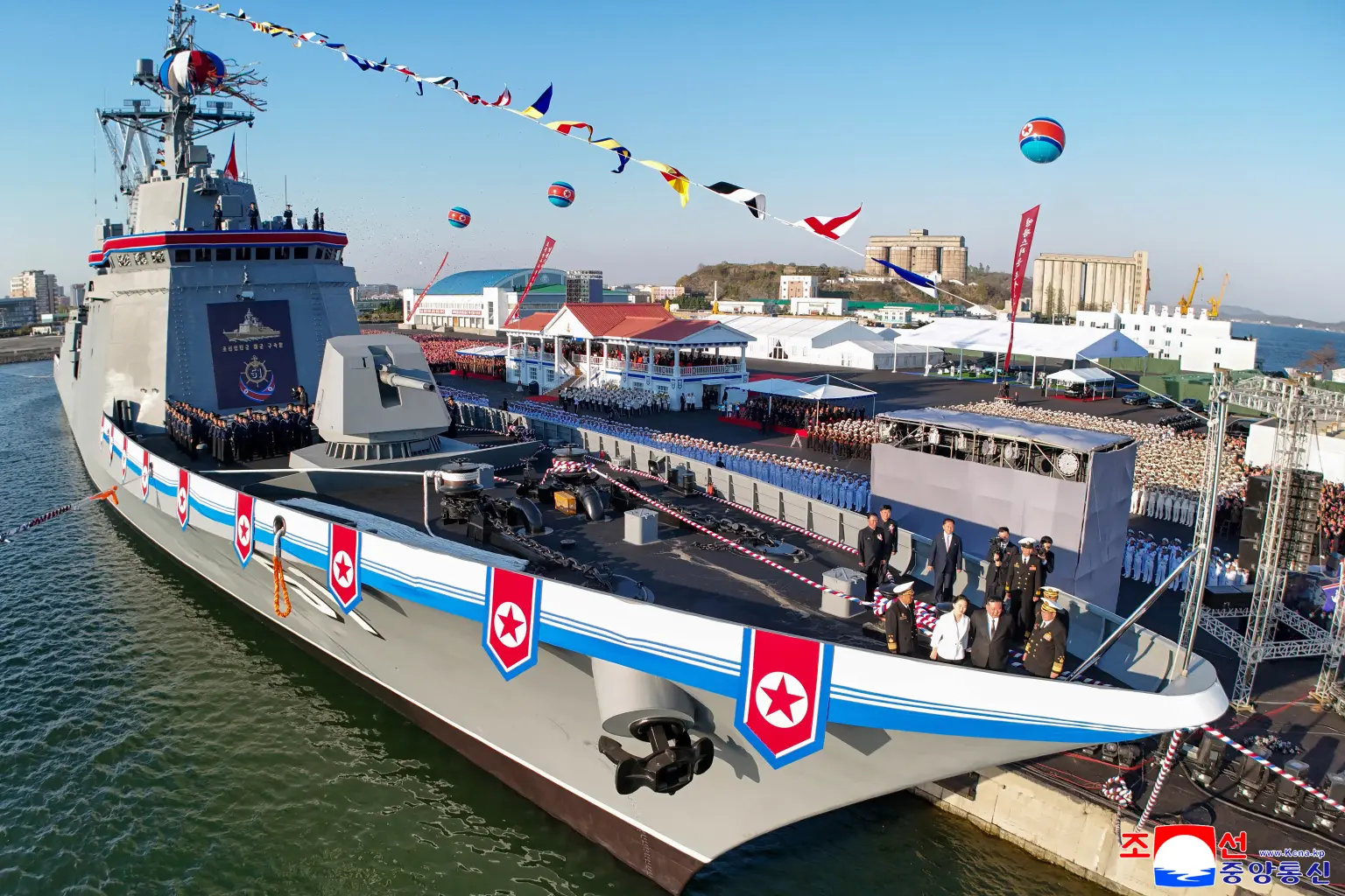 Kim Jong Un and his daughter Ju Ae stand on one of the new destoyers during the launch ceremony. KCNA VIA KNS/AFP via Getty Images