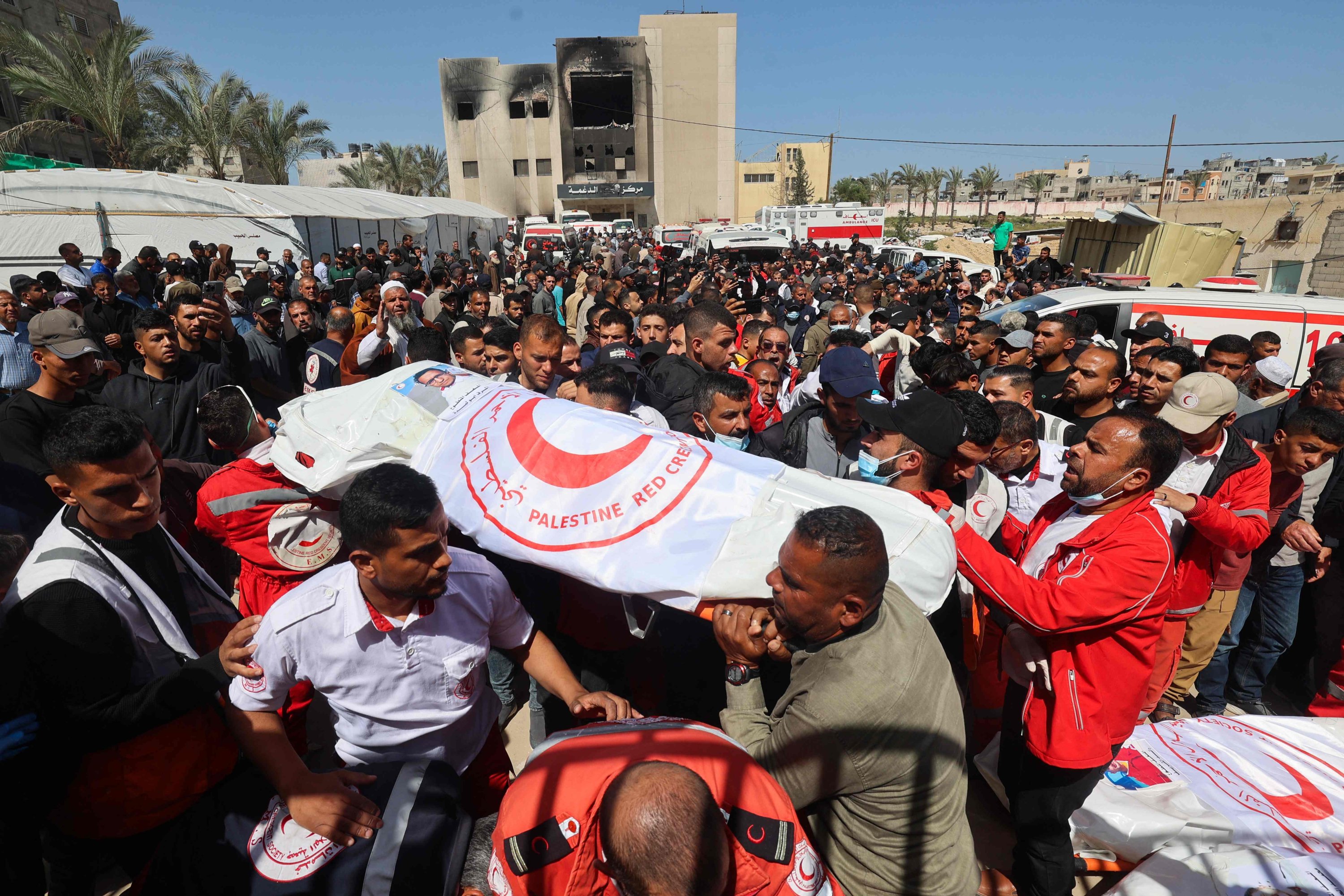 Members of the PRC and other emergency services carry bodies of fellow rescuers killed a week earlier by Israeli forces, in Khan Younis, Gaza Strip, Palestine, March 31, 2025. (AFP Photo)