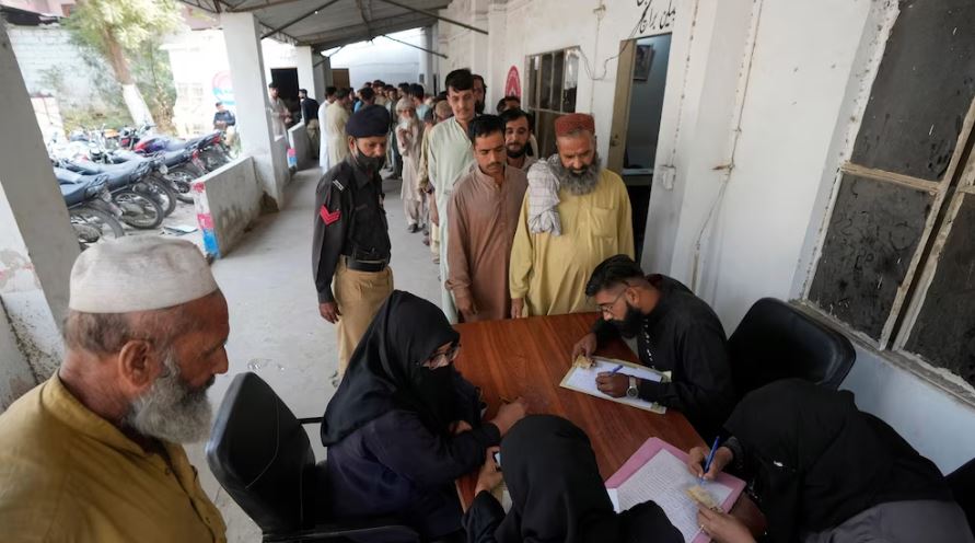 Immigrants, mostly Afghans, go through data verification process at a counter of Pakistan's National Database and Registration Authority, in Karachi, Pakistan,
