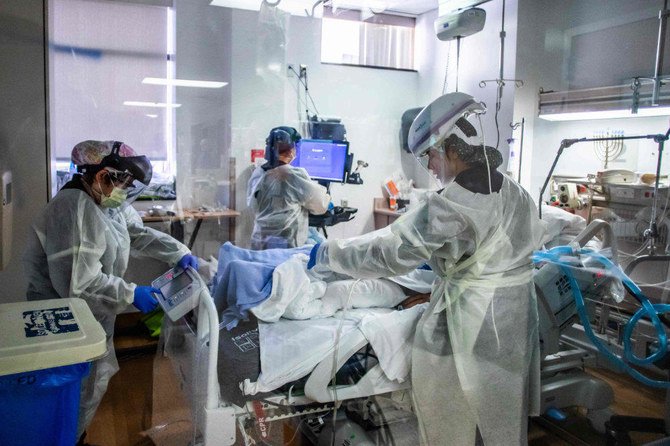 Nurses attend to a Covid-19 patient in the Intensive Care Unit (ICU), in California.