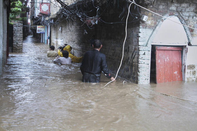 Flooded streets in Mingora, the main town of Swat Valley, northwestern Pakistan. (AP)