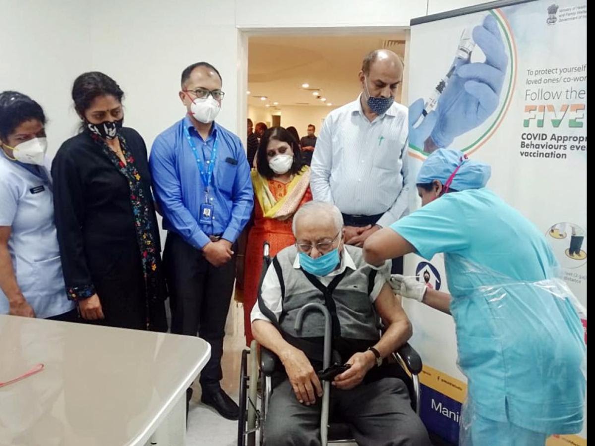 A 97-year-old man taking his first dose of COVID19 vaccine at Manipal Hospitals in Bengaluru.