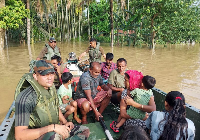 Indian Army carry out a flood rescue operation in various parts of Hojai District of Assam on Wednesday.