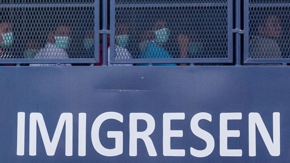 An immigration truck carrying Myanmar migrants from Malaysia back to their homeland.