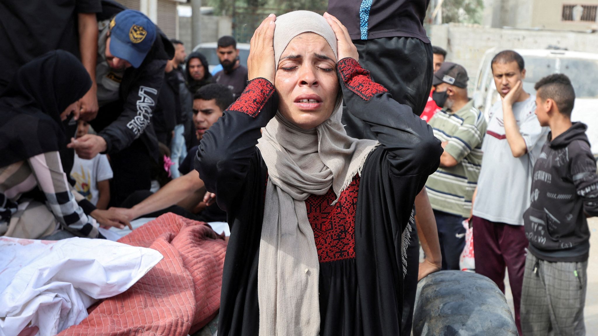 A family in grief at a funeral on Sunday in Deir al Balah, central Gaza. Photo: Reuters