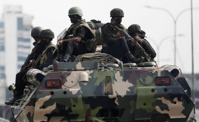 Sri Lankan army patrolling after curfew was extended for another day following a clash between anti-government demonstrators and Sri Lanka's ruling party supporters.