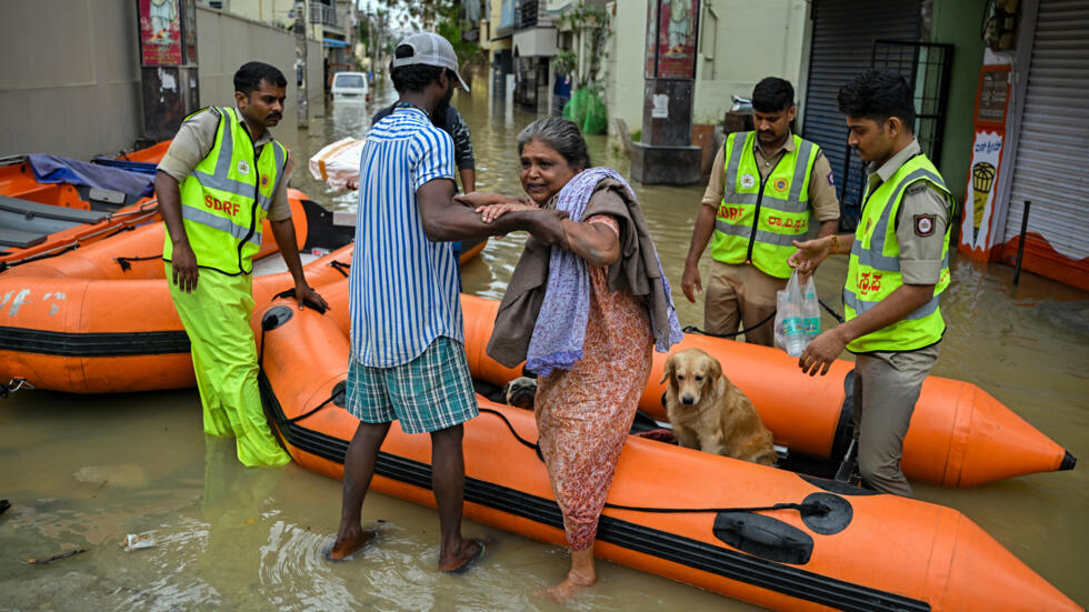 Residents were rescued by boats from flooded areas of Bengaluru © Idrees MOHAMMED / AFP